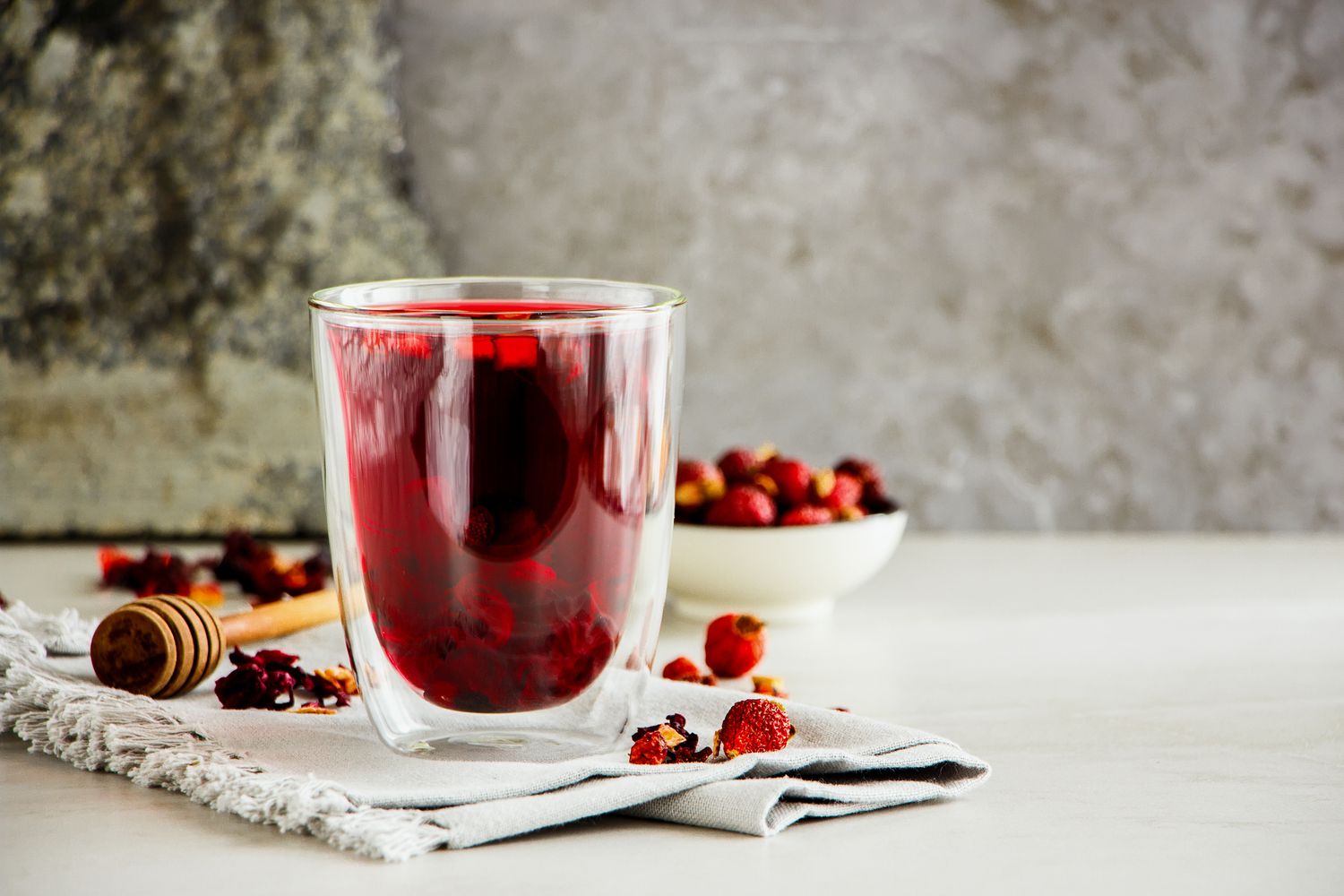 Hibiscus tea brewing with flowers all around
