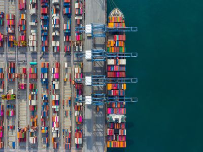 Container ship being unloaded