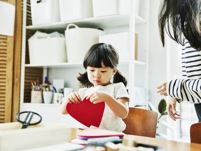 Young girl with paper hearts