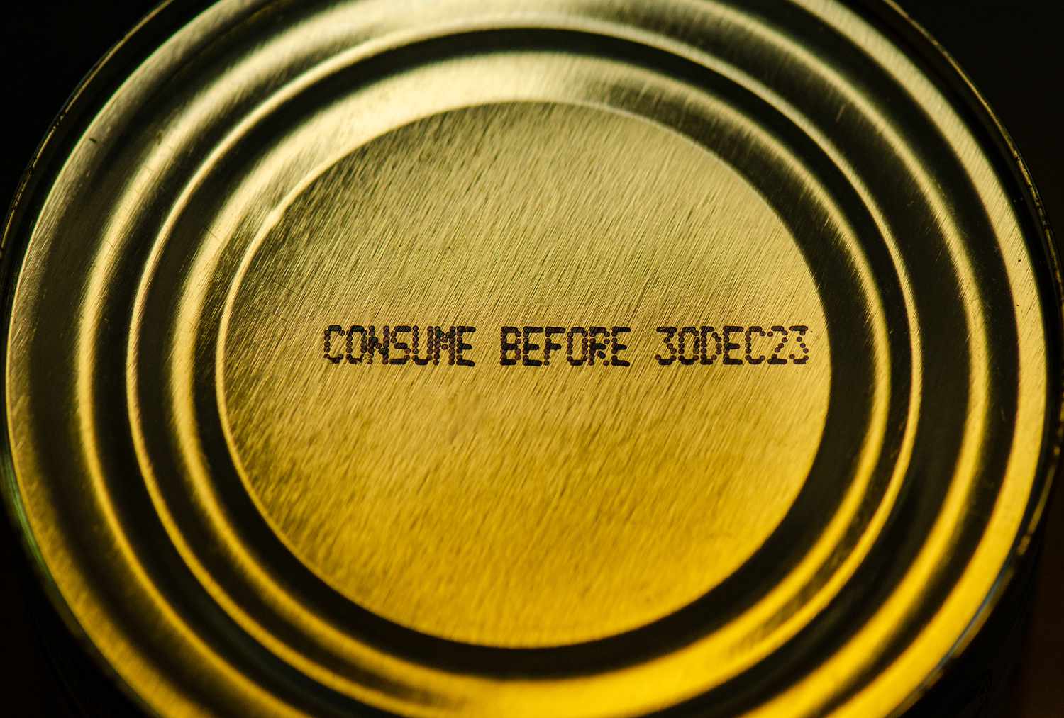 Overhead shot of a Tin Can of Tuna with Expiration date.