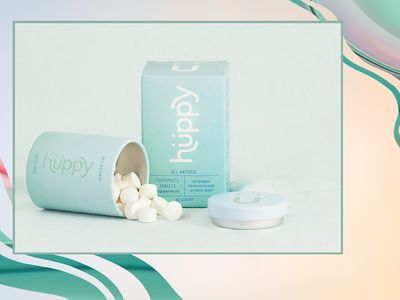 Toothpaste tabs coming out of a plastic-free container